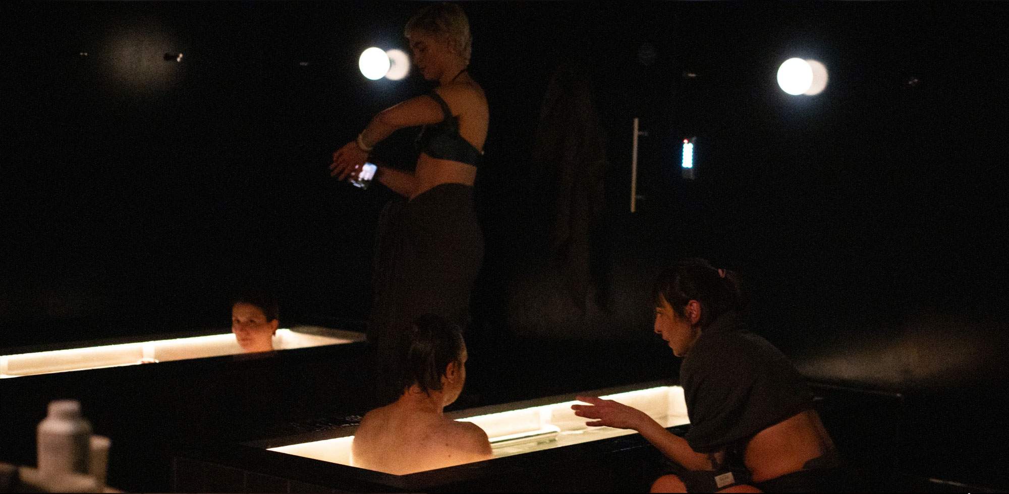 A group cold water immersion session in a communal contrast space